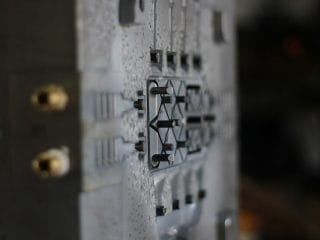 Multi cavity aluminium die casting tool in press showing runner, gating, and cavity detail